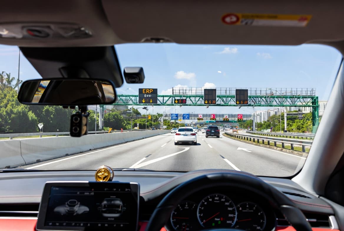 Driver's perspective on Singapore Pan-Island Expressway with ERP gantry signs